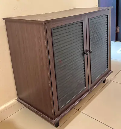 Compact wooden storage cabinet with louvered doors