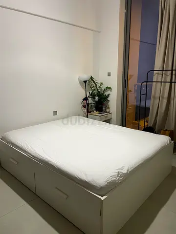 Queen storage bed with mattress — good condition