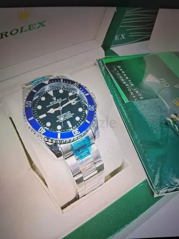 Rolex Submariner-style Stainless Steel Watch with Blue Ceramic Bezel