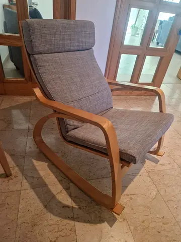 Comfortable wooden frame lounge chair with grey fabric cushion