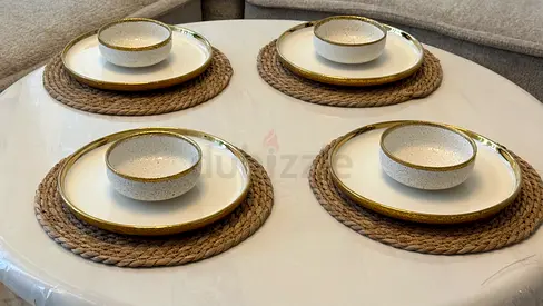 Set of decorative dinner plates and matching bowls