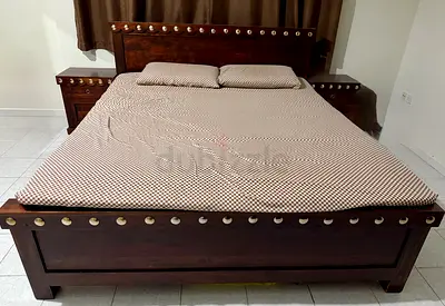 Solid dark wood king bed with matching bedside cabinets and dressing table. Without Mattress.