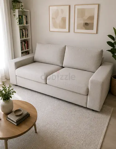 beige 2-seater sofa bed in excellent condition