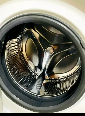 Front-load washing machine in good working condition (drum shown) - selling only 200AED