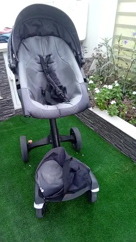Grey infant car seat with stroller frame — used, good condition,brand of stack with baby bag