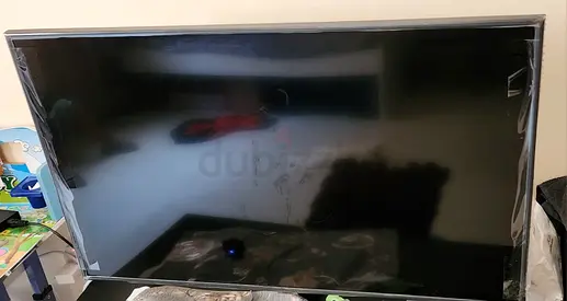 Sleek Flat Screen TV with Protective Film