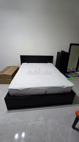 IKEA hydraulic Queen-size platform bed frame with storage - dark brown wood