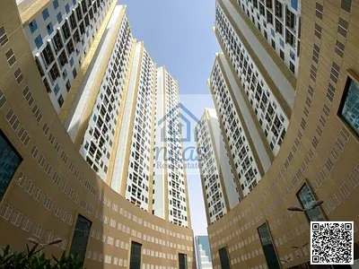 شقة بغرفة نوم واحدة وصالة مع موقف سيارات للبيع في برج لؤلؤة عجمان، وسط مدينة عجمان