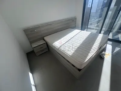Queen bed frame with mattress and matching bedside table - light grey wood