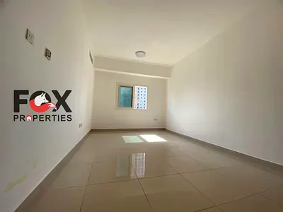 Luxury 2BR apartment for annual rent in Al Nuaimiya 1 with open-view balcony, parking, built-in wardrobes, and prime location opposite Gulfa Bridge.