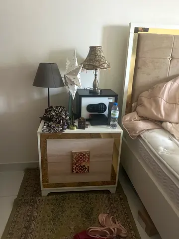 White bedside table/nightstand with gold trim - good used condition