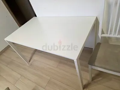 White Table and 2 white and beige chairs