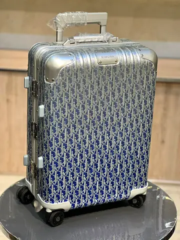Dior and Rimowa carry on suitcase