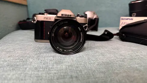 Nikon FM10 film SLR camera with Tokina 28-105mm  F3.5 lens (used)
