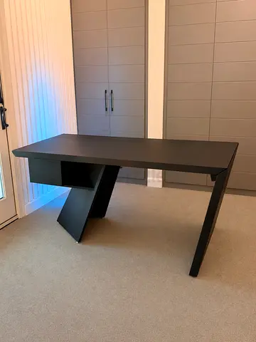 Modern black designer office desk with storage shelf
