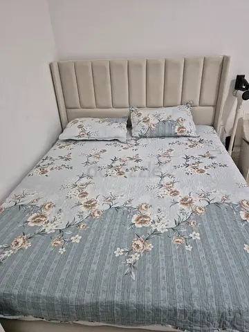 Queen size bed with upholstered headboard with matress.