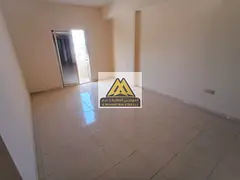 1-bedroom apartment with living room in Al Rawda 1, Ajman, featuring a balcony, closed kitchen, and