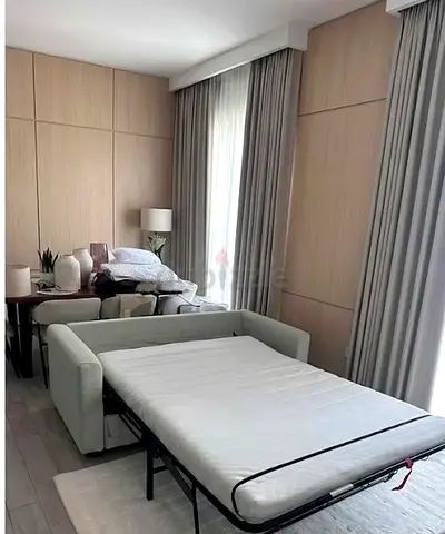 Light grey pull-out sofa bed in good condition