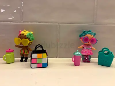 Two LOL Surprise dolls with accessories (2 dolls + bags + bottles)