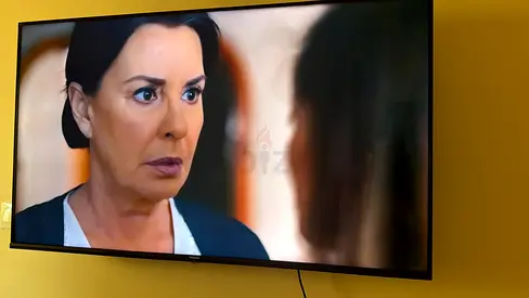 55-inch LED TV mounted on wall - working condition