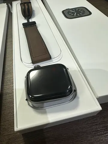 Apple Watch Series (like-new) with brown leather strap — boxed