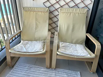 Pair of IKEA Poäng armchairs with cushions - beige frame