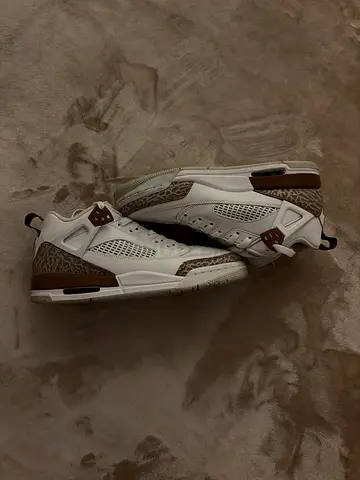 White and beige Jordan 4 sneakers, lightly used