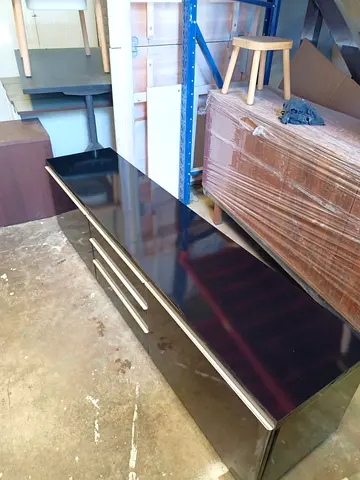 Low black TV unit / media cabinet with drawers