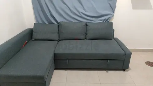 L-shaped grey fabric sofa with storage, good condition