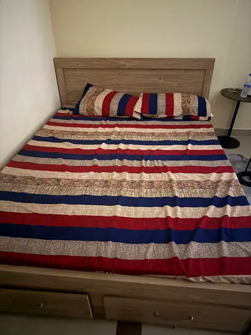 Wooden Double Bed with Mattress and Striped Bedding - Good Condition