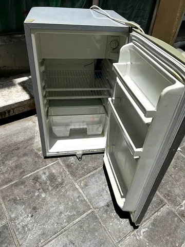 Small single-door mini fridge in working condition