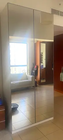 Tall mirrored wardrobe / armoire in good condition