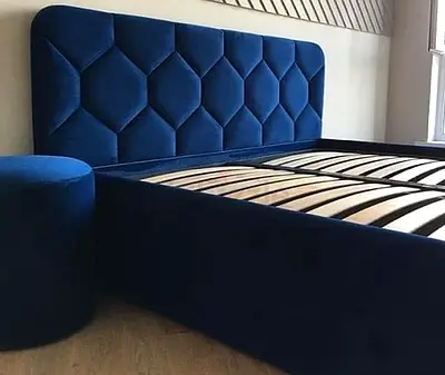 King-size navy blue upholstered bed frame with tufted headboard