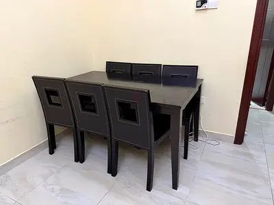 Table with 6 chairs ( There are only 5 chairs in good condition)