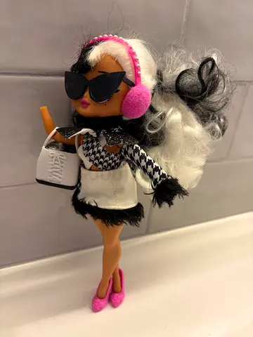LOL fashion dolls with black-and-white outfit and accessories