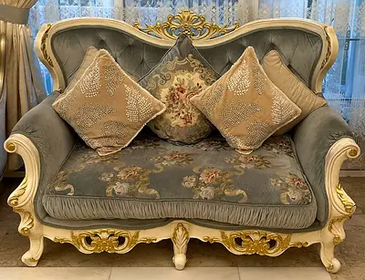 Classic Tufted Loveseat with Ornate Gold Detail