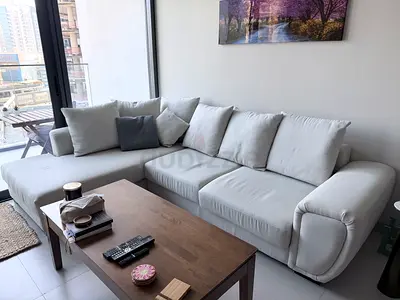 Light grey L-shaped fabric sofa with chaise - good condition
