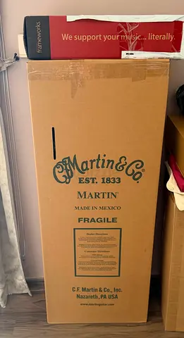 Martin acoustic guitar in original box — new/unused