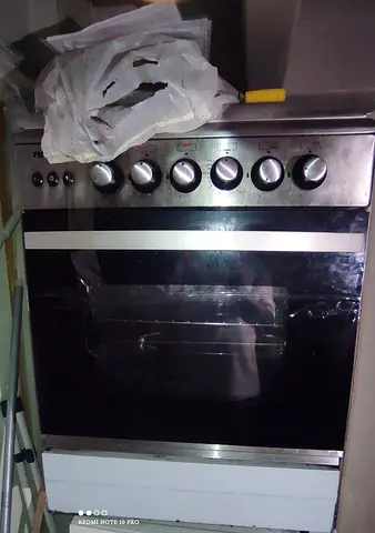 Used freestanding gas oven and stove - stainless steel front