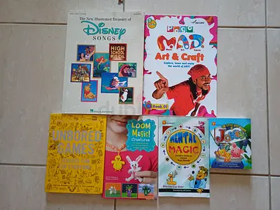 Collection of childrens activity books including Disney Songs, Art  Craft, jokes and magic