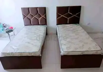 Two Single Beds with Upholstered Headboards and Mattresses