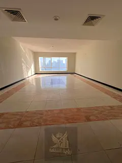 Beautiful 4-bedroom apartment with a living room in Al Majaz, free parking, swimming pool, and gym.