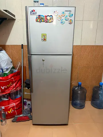 Silver double-door refrigerator in good working condition