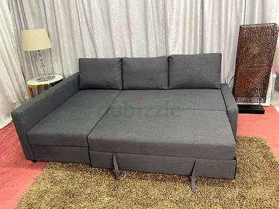 Gray L-shaped Sofa Bed with Storage - Good Condition