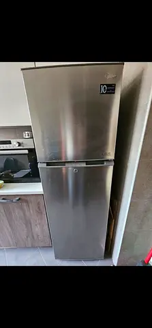 Used stainless steel top-freezer refrigerator - good condition