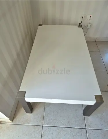 Simple white coffee table with metal legs - good condition