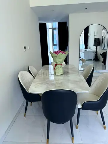 Marble-top dining table with 6 modern upholstered chairs