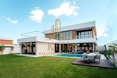 A luxurious villa featuring 5 master bedrooms with high-end finishes, spacious areas, and integrated