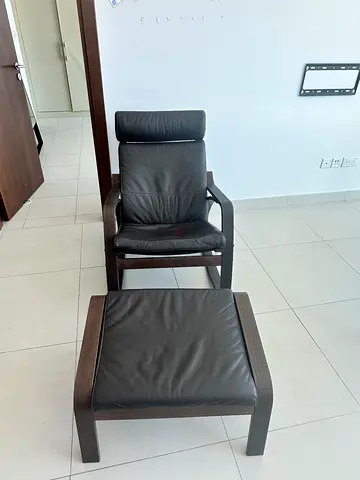 Dark wood reclining lounge chair with matching footstool