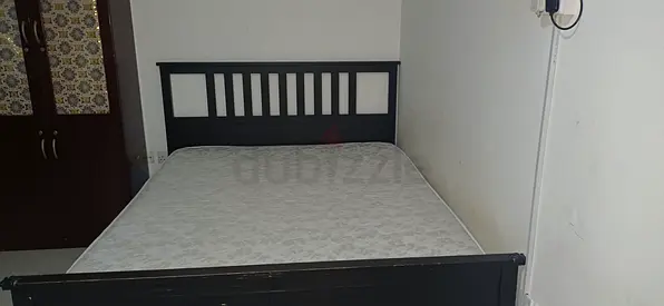 Black wooden double bed with mattress - good condition